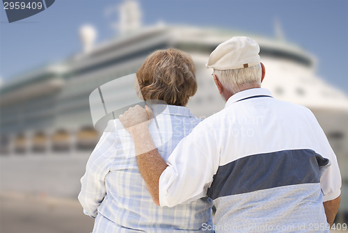 Image of Senior Couple On Shore Looking at Cruise Ship