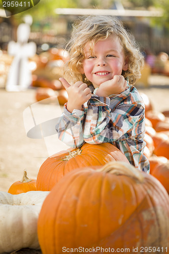 Image of Cute Little Boy Gives Thumbs Up at Pumpkin Patch