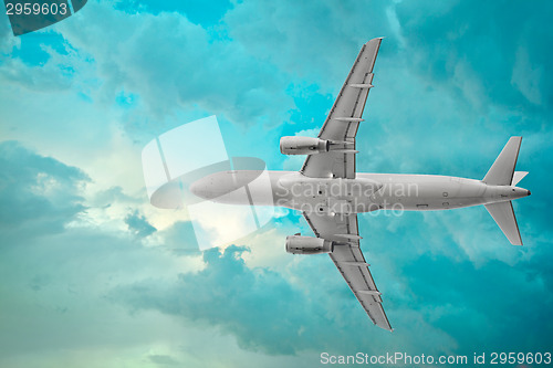 Image of Passenger airplane in the beautiful cumulus clouds