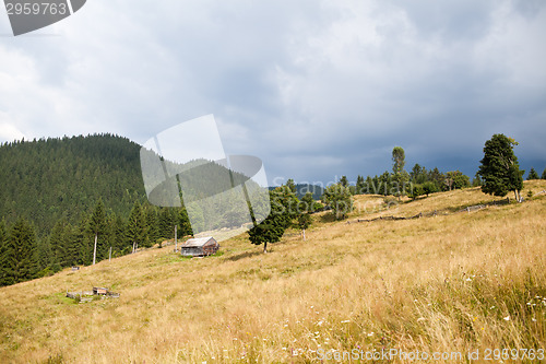 Image of Cloudy stormy sky above mountain