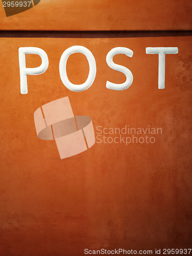 Image of Rusty orange mailbox
