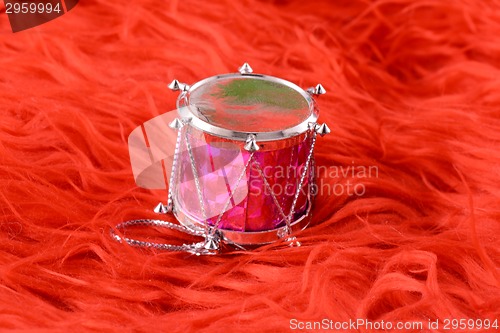 Image of Christmas toy drum isolated on red background