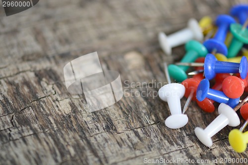 Image of Set of old pins on wood background