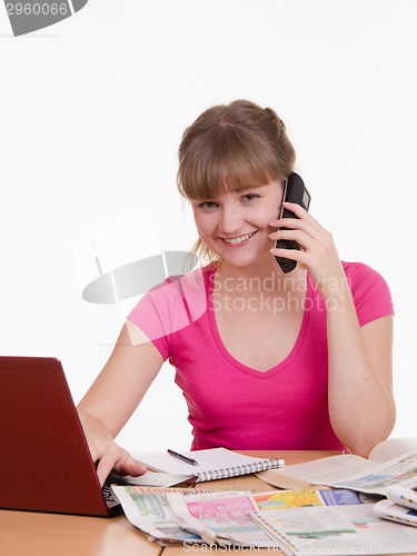 Image of Girl talking on the phone with employer