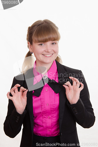 Image of Girl holding a butterfly on shirt