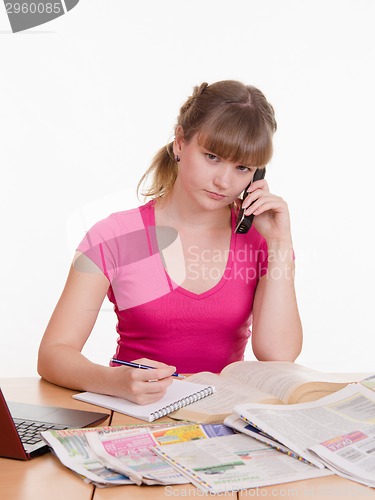 Image of Girl seriously talking on the phone