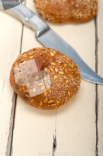 Image of organic bread over rustic table