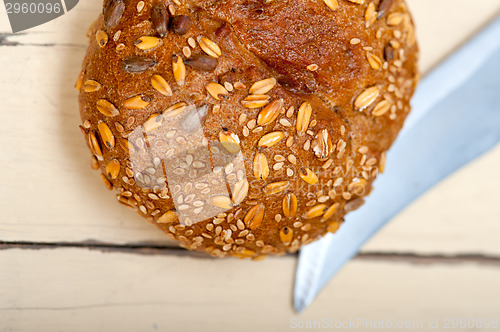 Image of organic bread over rustic table