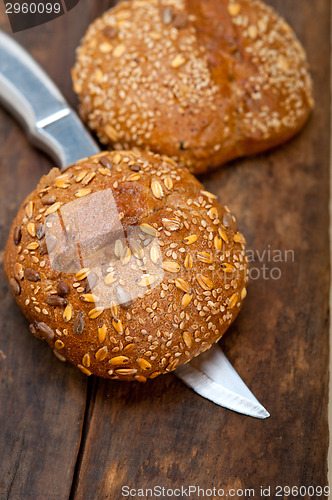 Image of organic bread over rustic table