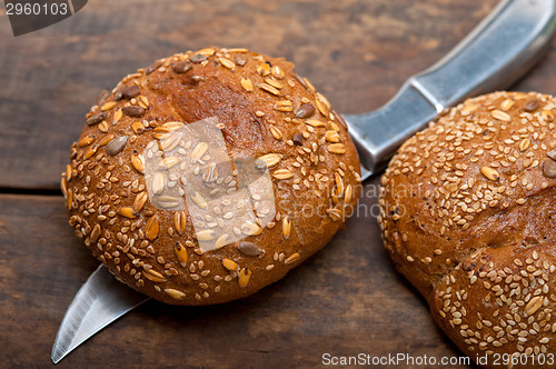 Image of organic bread over rustic table