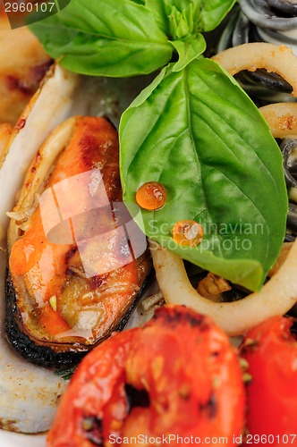 Image of Black Pasta with sea food and basil