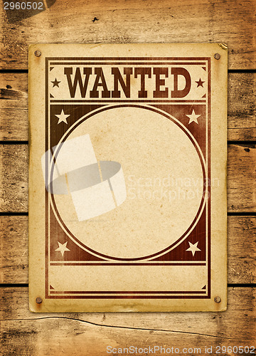 Image of Wanted poster on a wood board