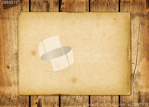 Image of Blank vintage paper sheet on a wood board