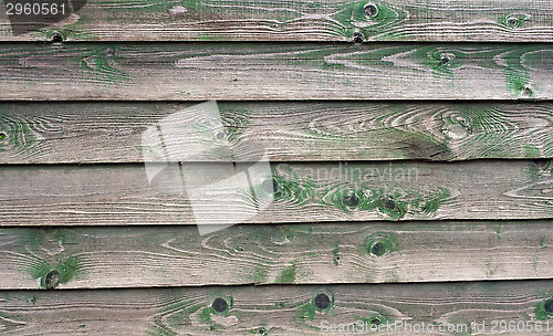 Image of Texture of wall made of planks with paint peeling off close-up