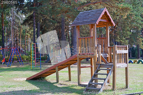 Image of Wooden slide on playground