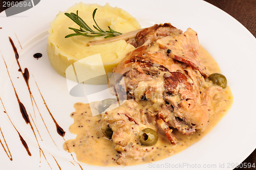 Image of Rabbit legs with potato puree and rosemary