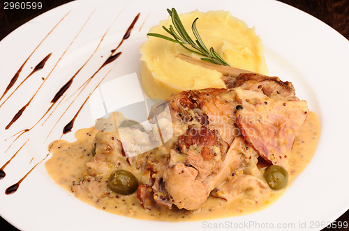 Image of Rabbit legs with potato puree and rosemary