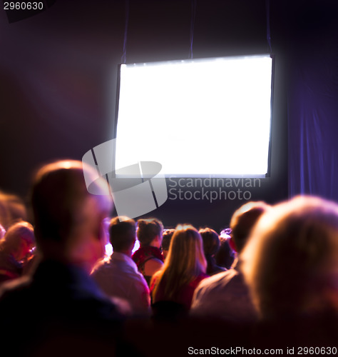 Image of Crowd audience looking at screen