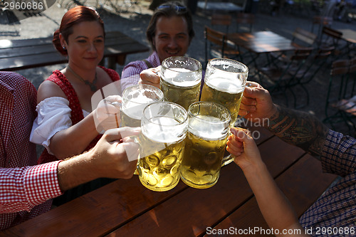 Image of People drinking beer in a traditional Bavarian beer garden