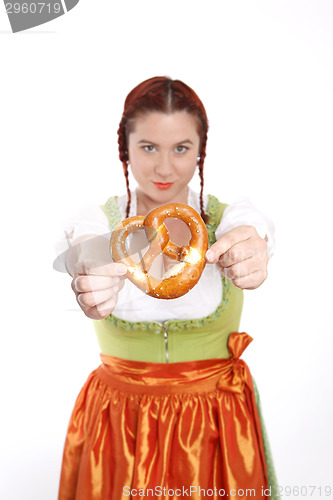 Image of Young red head woman in traditional bavarian costume