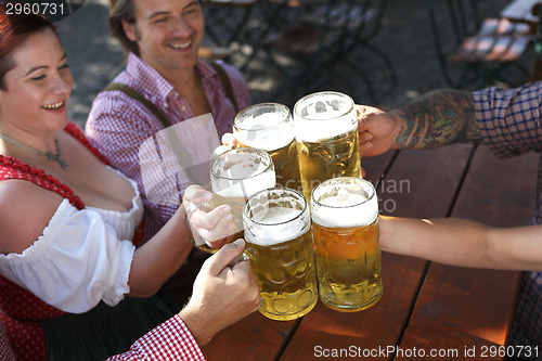 Image of People drinking beer in a traditional Bavarian beer garden