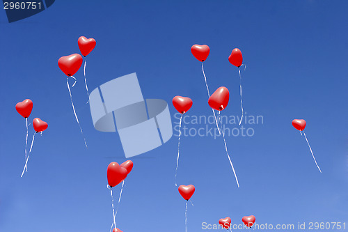 Image of Red balloon hearts in the sky