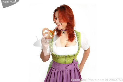 Image of Young red head woman in traditional bavarian costume