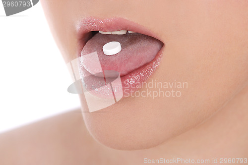 Image of Woman takes pill