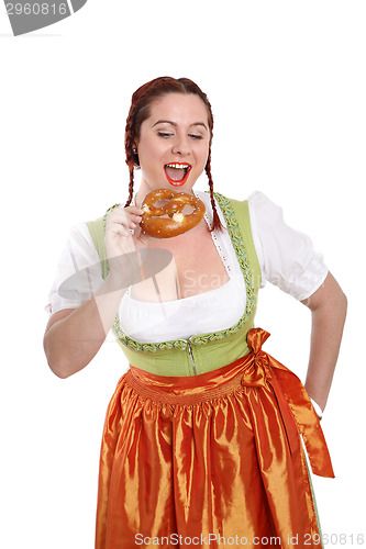 Image of Young red head woman in traditional bavarian costume