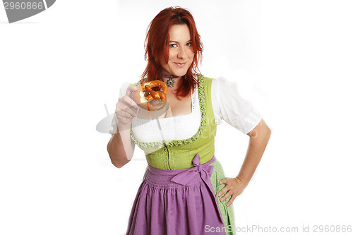 Image of Young red head woman in traditional bavarian costume