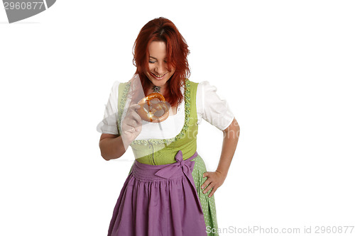 Image of Young red head woman in traditional bavarian costume