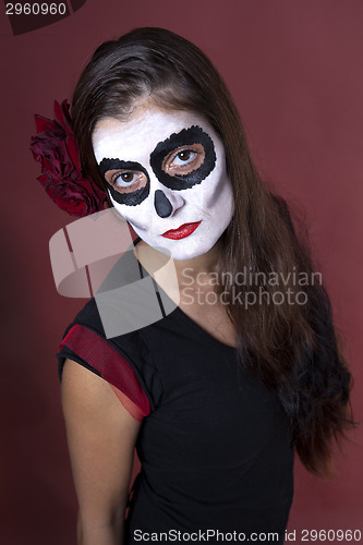 Image of Woman with makeup of la Santa Muerte with red roses