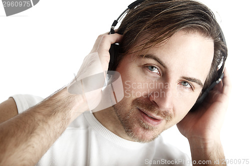 Image of Attractive man with headphones in front of a white background lo