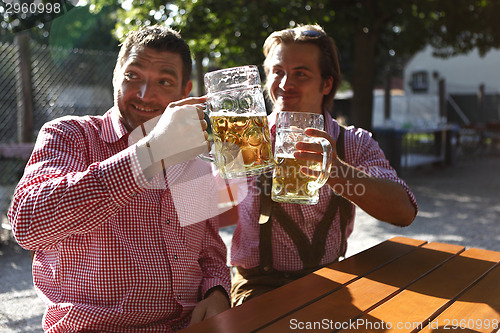 Image of Two Bavarians sitting in a beer garden 