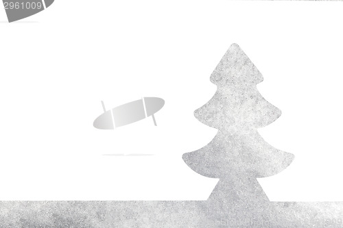 Image of Christmas tree in silver snow