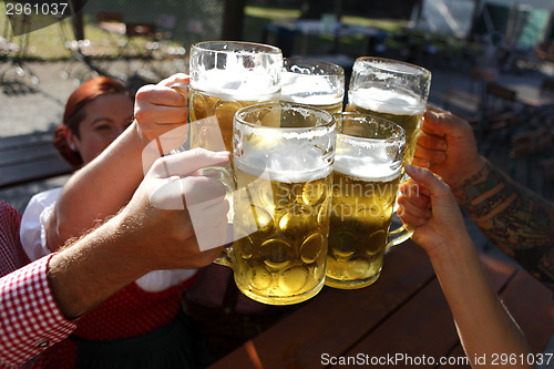 Image of People drinking beer in a traditional Bavarian beer garden