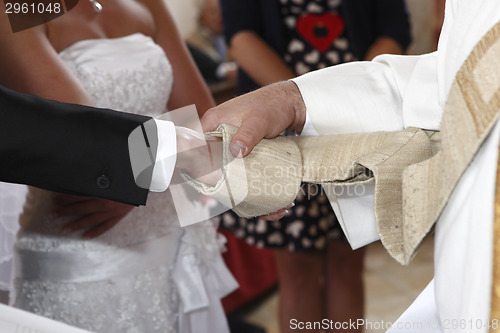 Image of Hands of a bride and groom