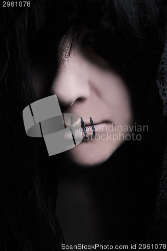 Image of Dark female character with black cape