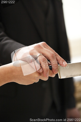 Image of Hands of a bride and groom