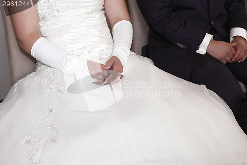 Image of Hands of a bride and groom