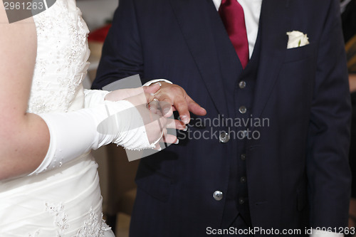 Image of Hands of a bride and groom