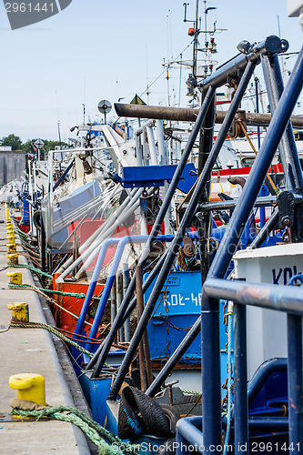 Image of fishing cutter in a port