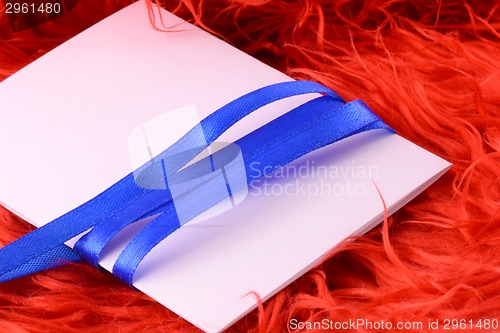 Image of Greeting card with white paper and blue bow