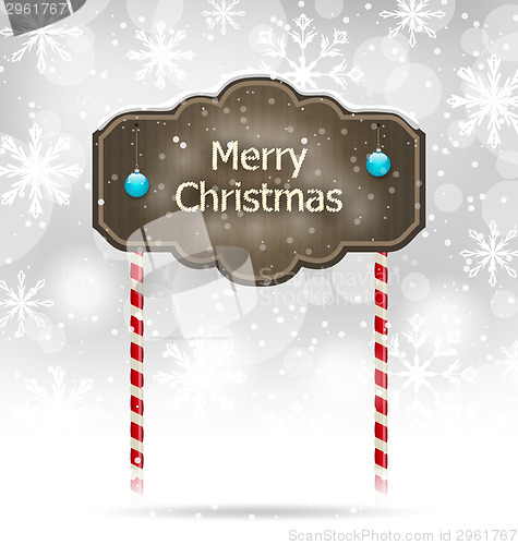 Image of Snow covered wooden sign, Merry Christmas background 