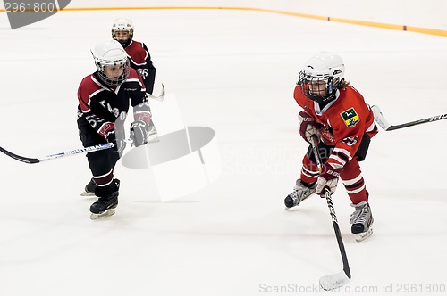 Image of Game of children ice-hockey teams