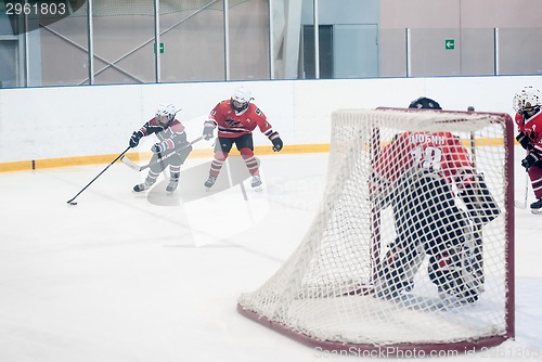 Image of Game of children ice-hockey teams