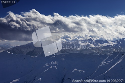 Image of Evening mountains and sunlight clouds