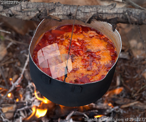 Image of Cooking borscht (Ukrainian traditional soup) on campfire