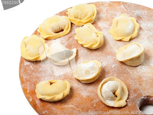 Image of Homemade ravioli on kitchen wooden board