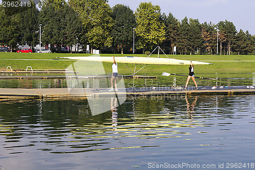 Image of Rowers wear boat